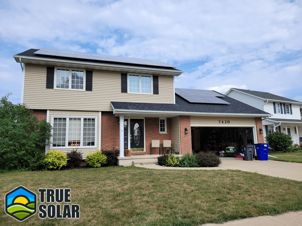 Photograph illustrating a home solar installation in Iowa by True Solar, featuring a well-organized assembly of home solar panels on the roof, efficiently utilizing the abundant sunlight in Iowa to produce clean, renewable energy.